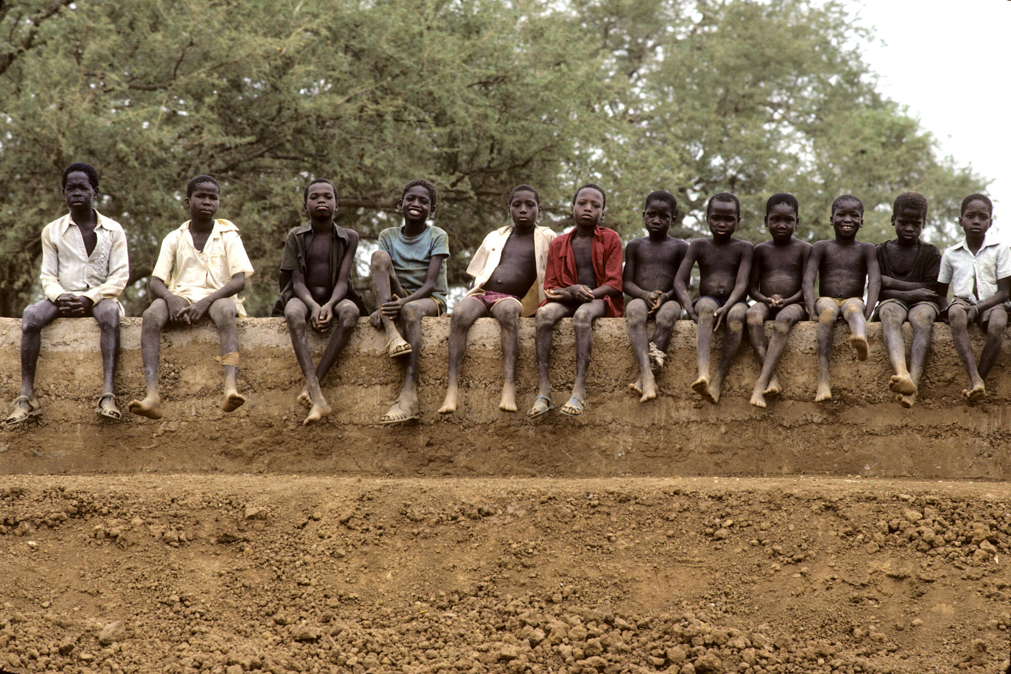 Countries in the Sahel, a band of land on the southern edge of the Sahara, are still affected by a crisis of alarming proportions. Drought and famine which have manifested themselves since the late 1960s, still continue. 
School children in Kaona. April 1986.
