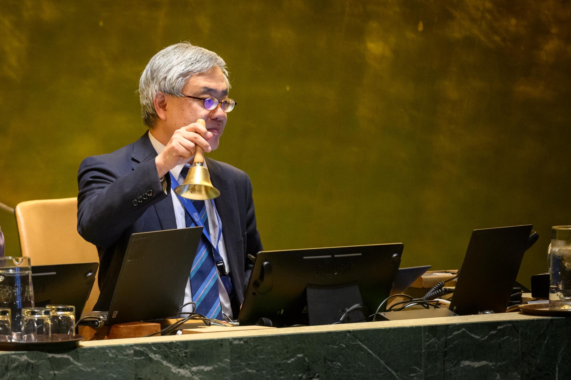 Kenji Nakano, Chief of the General Assembly Affairs Branch, Department for General Assembly and Conference Management (DGACM), signals the start of the 23rd plenary meeting of the General Assembly that heard a report of the International Atomic Energy Agency.